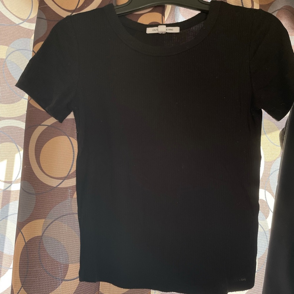Caution to the wind black tee shirt